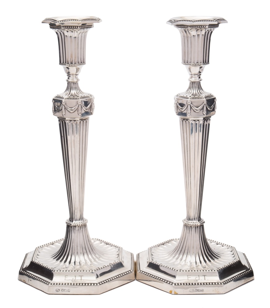 A pair of George V silver candlesticks, maker John Round & Sons Ltd,