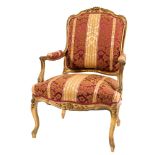 A carved giltwood fauteuil in the Louis XV taste:,