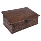 An early 18th Century oak bible box:, with a plain sloping hinged top,