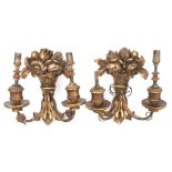 A pair of Continental carved giltwood wall lights: each backplate in the form of a basket of