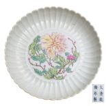 A Chinese yellow ground famille rose 'peony' dish: with fluted rim,