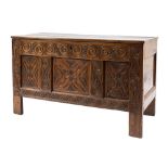 An early 18th Century carved oak rectangular coffer:, with a plain hinged top,