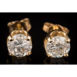 A pair of diamond single-stone ear-studs: each with a circular brilliant-cut diamond approximately