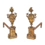 A pair of French gilt brass urn chenets:,