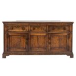 An 18th Century oak rectangular dresser base:, the top with a moulded edge,