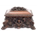 A 19th century carved oak casket: of sarcophagus outline,