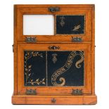 A late Victorian satin walnut Gordon writing cabinet: the upper fall front with tooled leather