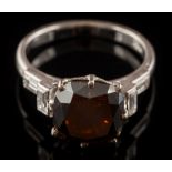 A natural fancy, very dark brown diamond single-stone ring: the cushion-shaped,