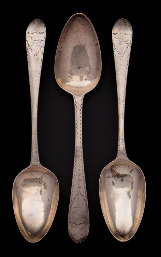 A George III Irish silver table spoon, maker Michael Keating , Dublin 1804: crested,