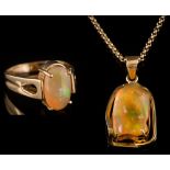 A yellow metal and irregular jelly opal,