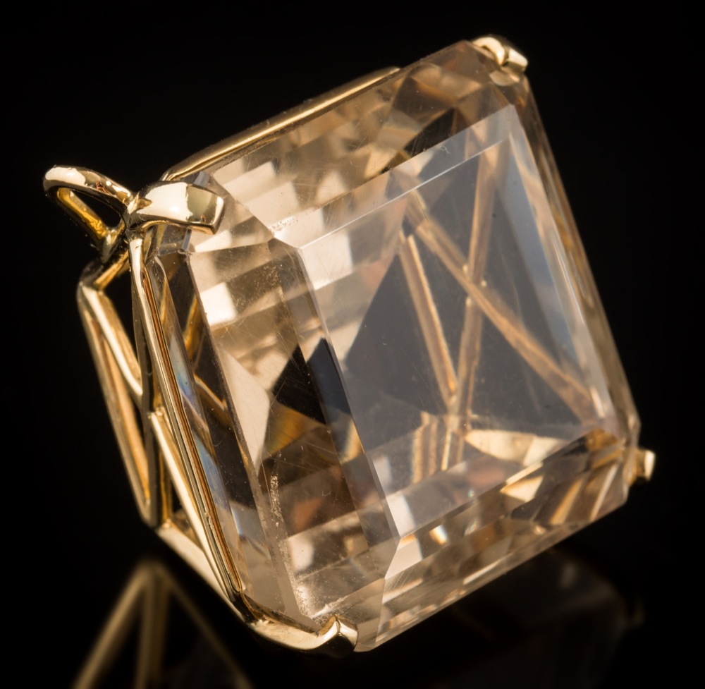 A large smoky quartz single-stone pendant: the square smoky quartz approximately 30mm wide in