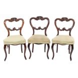 A set of six Victorian carved rosewood dining chairs:,