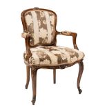 A carved beechwood fauteuil in the Louis XV taste:,