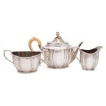 A Victorian matched silver three-piece tea service, various makers, London, 1882,