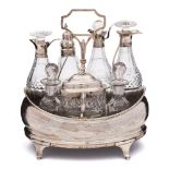 A George III silver cruet stand, all marks worn: crested,