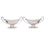 A pair of Victorian silver pedestal salts, maker Edward Hutton, London,