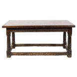 A 17th century oak dining table of refectory type:, with an adapted plank top,