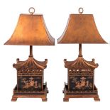 A pair of black lacquer giltwood and chinoiserie decorated Pagoda lamps:, with gilt metal shades,