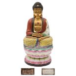 A Chinese porcelain figure of Buddha: in dhyana mudra pose,