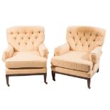 A pair of Edwardian mahogany frame armchairs:, fully upholstered in pale yellow damask fabric,