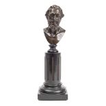 A 19th century bronze bust of a bearded man: unsigned, mounted on a fluted column and socle,