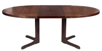 A 1960's teak oval extending dining table:, on a cruciform pillar and base,