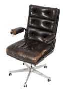 A 1960's chromium and leather revolving office armchair:, with dark brown buttoned leather back,