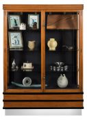 An Art Deco oak, ebonised and chromium display cabinet:, with an angular channelled cornice,