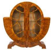 An Art Deco walnut veneer display cabinet:, of circular form,