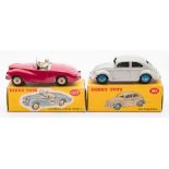Dinky No 107 Sunbeam Alpine Sports Car:, cerise body with white plastic driver, no decals,