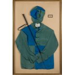 A framed set of blue and green jockey silks for E B Glenn:,
