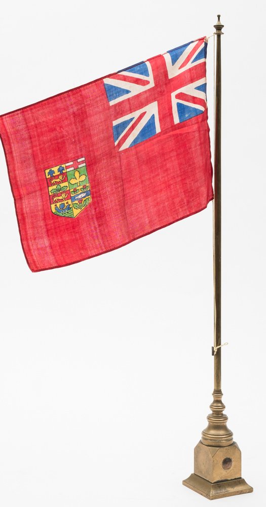 A WWI period Canadian Consular flag on brass stand:, 63cm high.