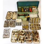 A collection of fly tins: containing wet and dry trout flies and lures, together with spinners,