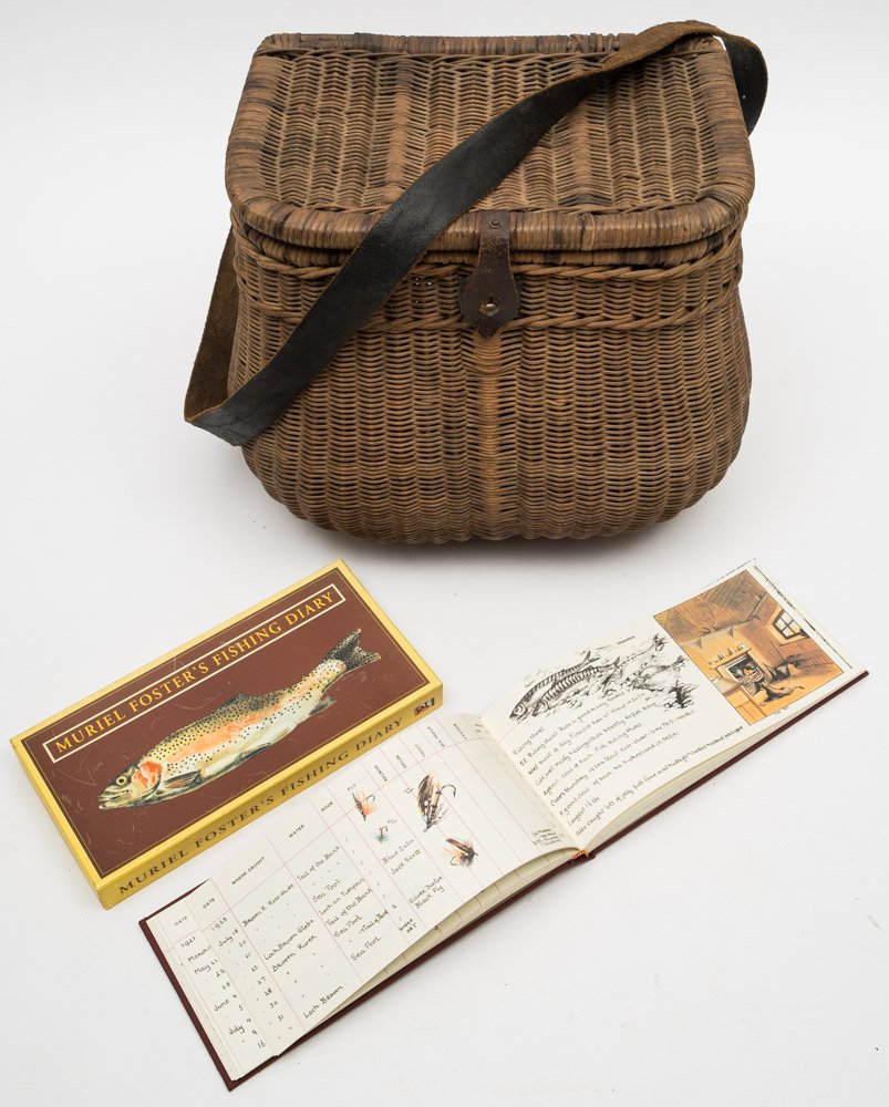 An early 20th century wicker creel/fishing seat:, with brown leather shoulder strap,