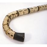 An early 20th century shark vertebrae walking stick:, 91cm.