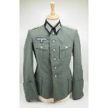 4.1.) Uniformen / Kopfbedeckungen Wehrmacht: Geschönte Feldbluse für einen Leutnant der Infanterie.