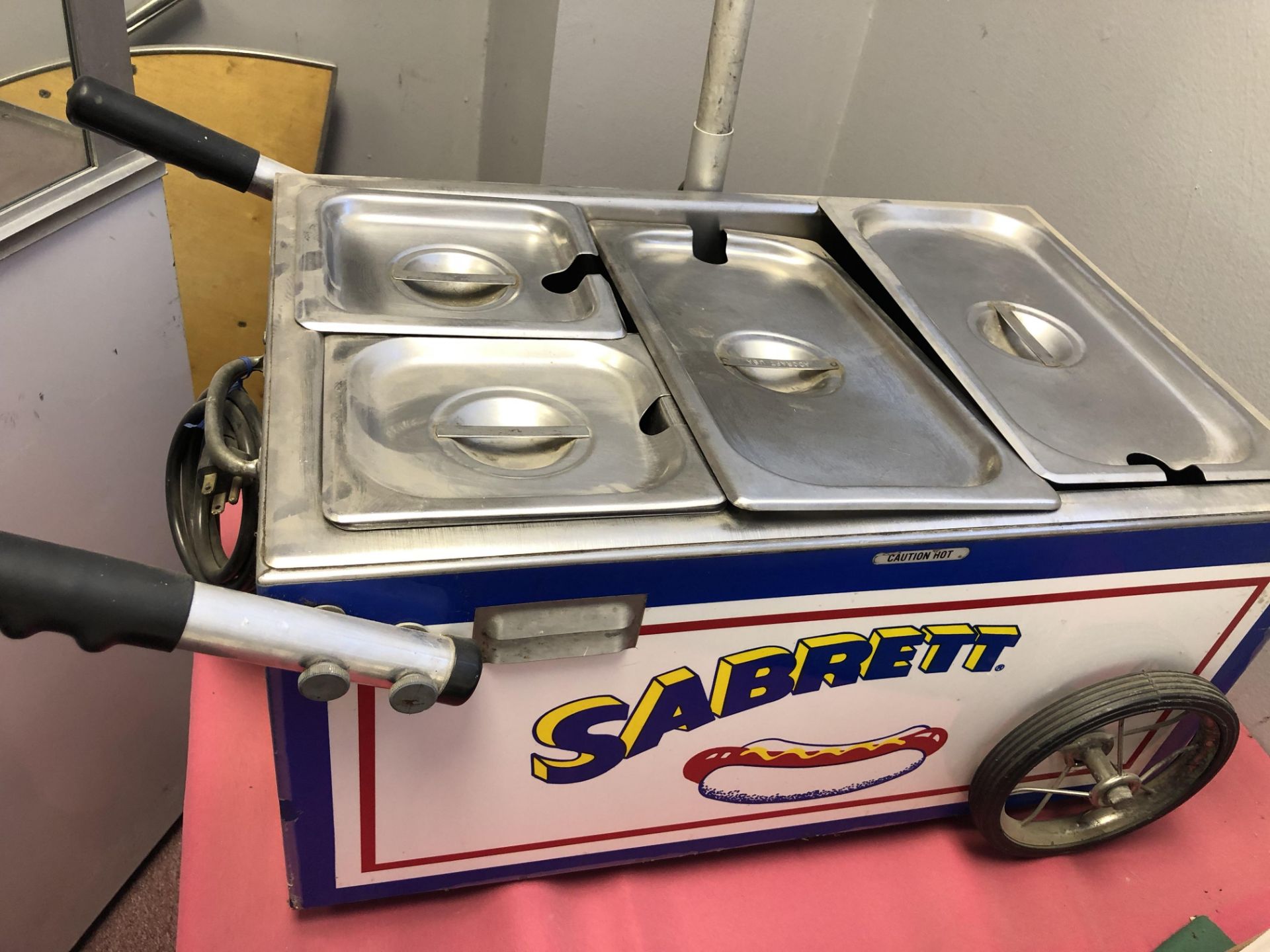 1 table top Sabrett Hot Dog Cart with umbrella