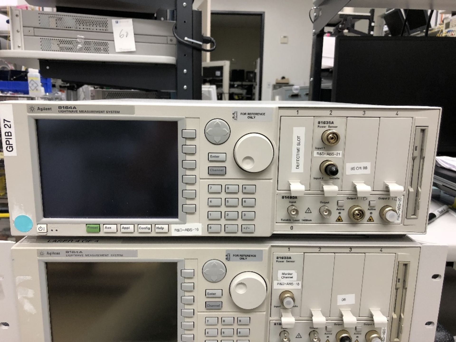 Agilent 8164A Lightwave Measurement System, (1) 81635A Power Sensor, (1) 81640A Tunable Laser