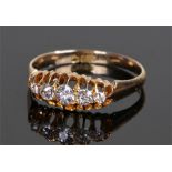 18 carat gold diamond set ring, with a row five diamonds to the tapered head, ring size R