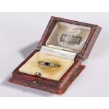 18 carat gold sapphire and diamond set ring, housed within the leather clad ring box