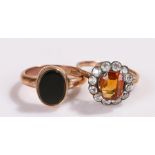 9 carat gold ring with centrally set black stone together with a yellow metal ring with central