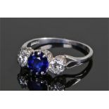 Platinum diamond and sapphire ring, the central sapphire at 6mm diameter flanked by a diamond to