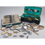 A box of costume jewellery containing watches, brooches, necklaces, etc,together with a boxed set of