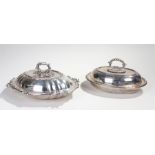 Two silver plated entrée dishes, the first with scroll leaf edge and a branch effect handle, the