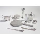 Silver, various dates and makers, to include glass silver topped canisters, a mirror frame, napkin