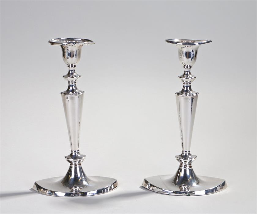 Pair of George V silver candlesticks, Sheffield 1918, the sticks of naiveté form, 23cm high