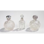 Three silver and cut glass scent bottles, various dates and makers, the first with a portcullis