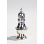 Elizabeth II silver caster, the top with a finial above the pierced dome and baluster body, 6.1oz