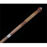Coquilla nut topped stick, the carved nut unscrews to reveal a glass vial for pencil leads, the