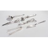 Silver plated objects, to include two pairs of grape scissors, a silver plated sauce ladle and